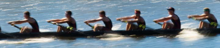 Speeding rowing boat with motion blur to accent speed.